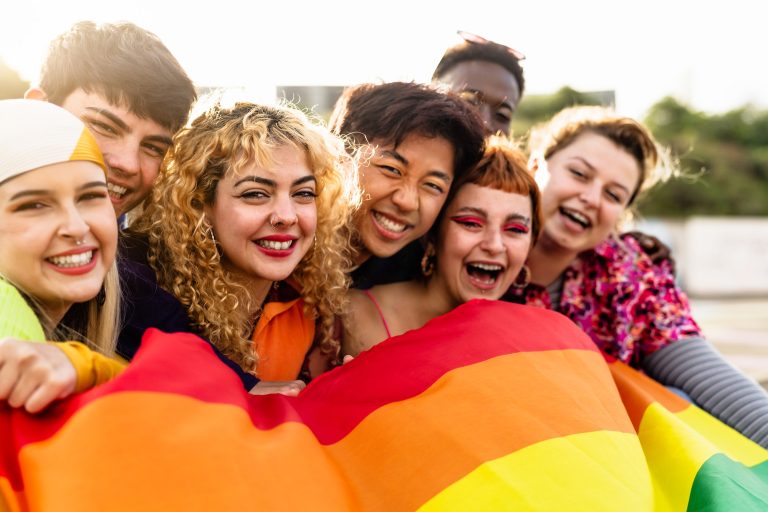 Diverse young friends celebrating gay pride festival - LGBTQ community concept